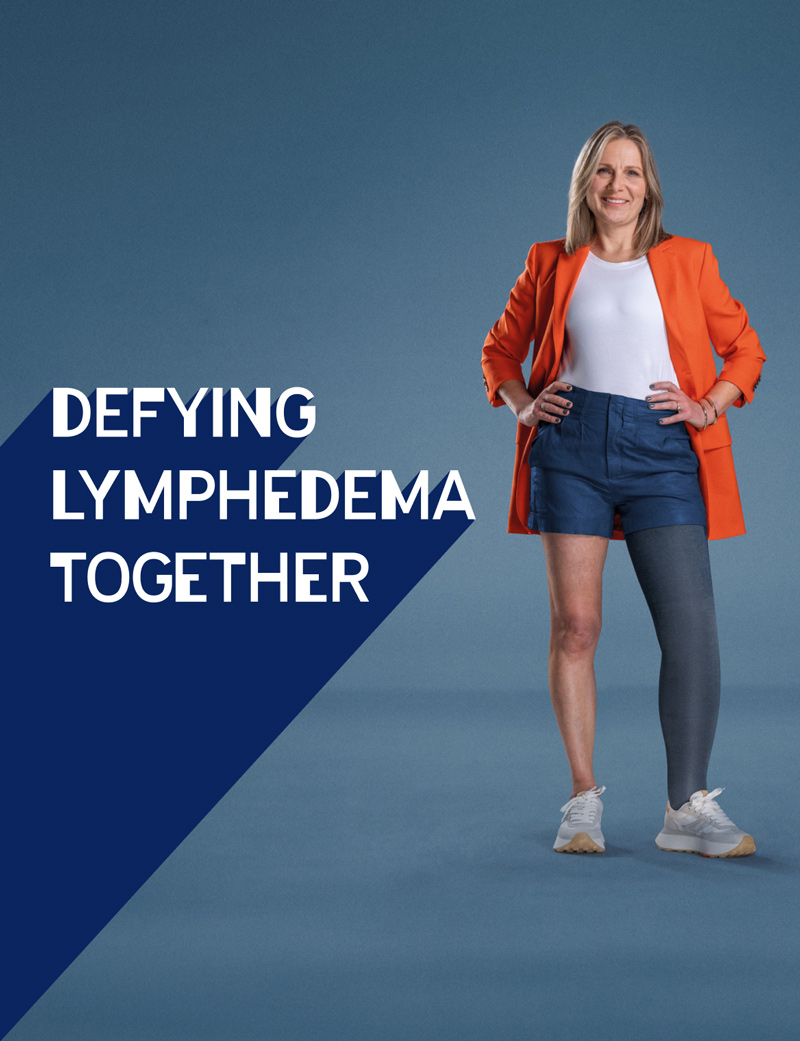 Poster of Julie in an orange blazer and grey compression garment on her leg. The text reads: Defying lymphedema together. Poster of Julie in an orange blazer and grey compression garment on her leg. The text reads: Defying lymphedema together.